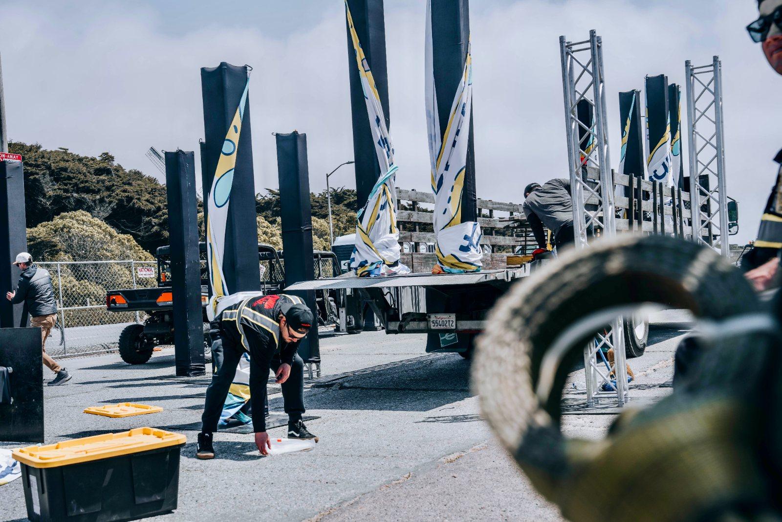 Silverback crew installing course banners and truss on race morning