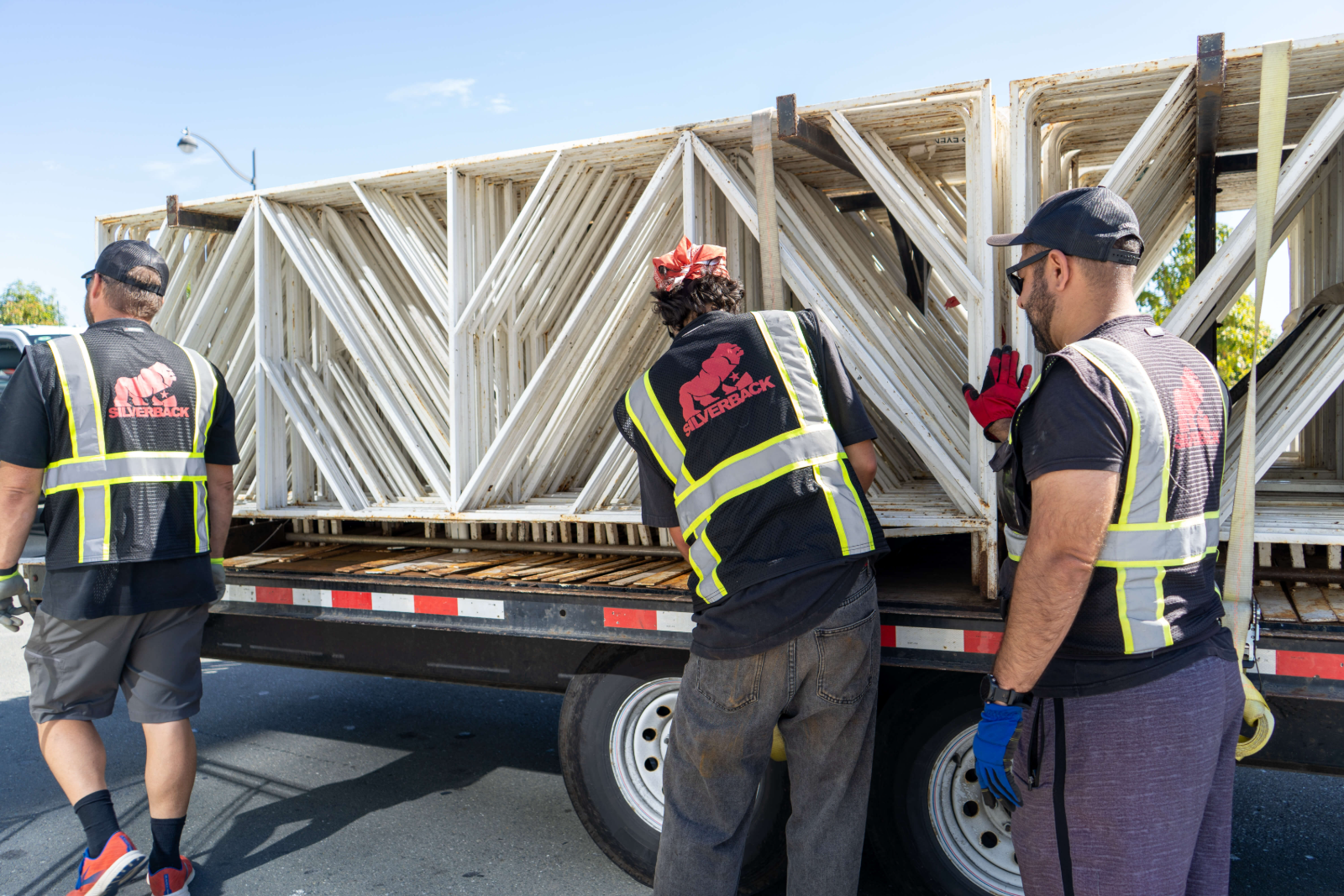 Silverback crew offloading barricade panels from a flatbed truck at the Chase Corporate Challenge