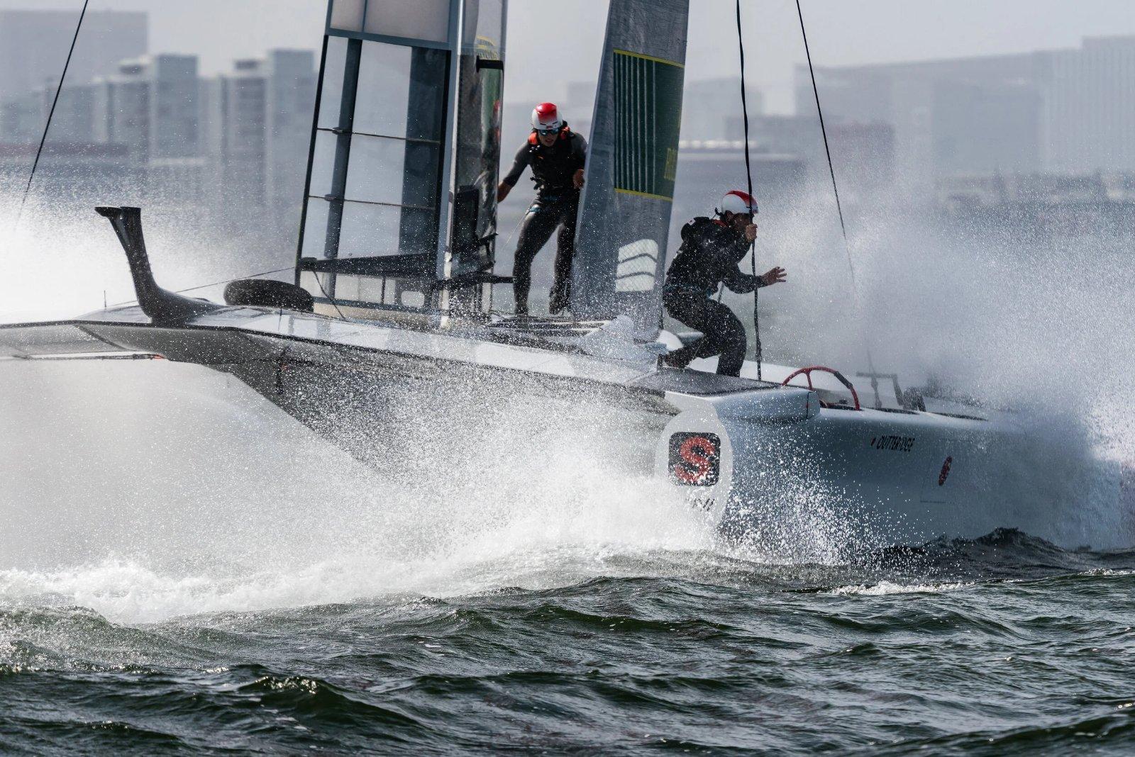 SailGP crew working the boat at speed