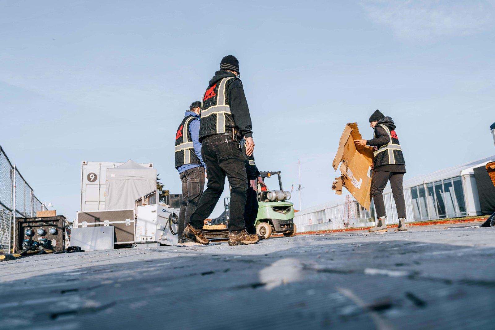 Silverback crew moving gear during SailGP load-in on the San Francisco waterfront